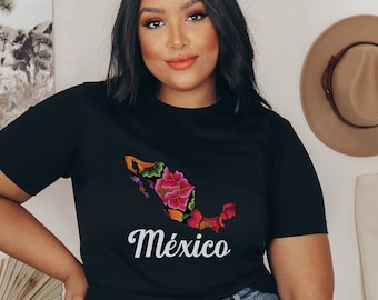 May include: A black t-shirt featuring a floral design of Mexico and the word "México" in white lettering.