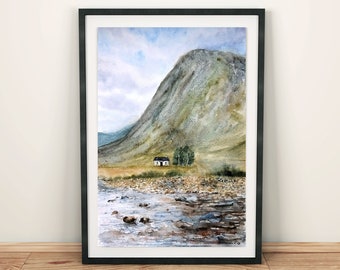 May include: A watercolour painting of a small white cottage nestled at the foot of a large, green mountain. The cottage has a dark roof and a small window. The mountain is painted in shades of green and brown, with a hint of blue in the sky. The painting is framed in a black frame.