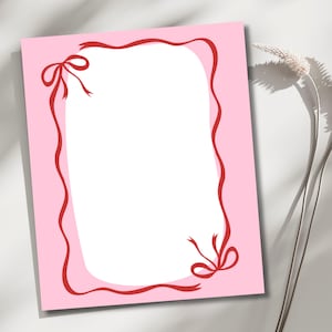 May include: A pink card with a red ribbon border and bows at the corners. The card has a white interior, perfect for writing a message. The design is simple and elegant, suitable for various occasions.