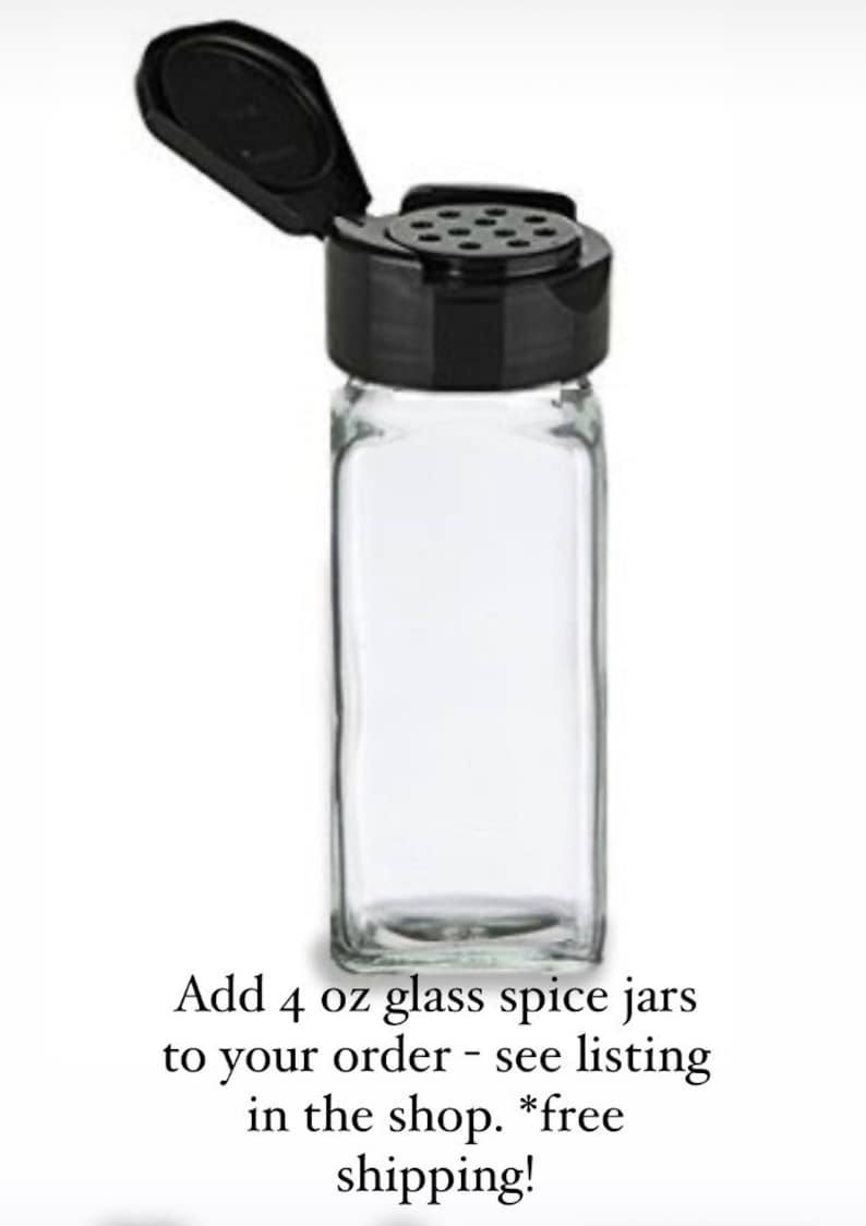 May include: Four clear glass spice jars with black shaker lids. Each jar is 4 ounces.
