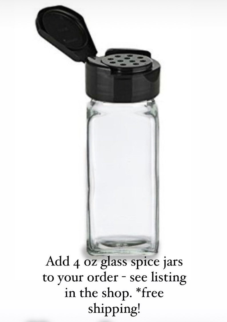 May include: Four clear glass spice jars with black shaker lids. Each jar is 4 ounces.