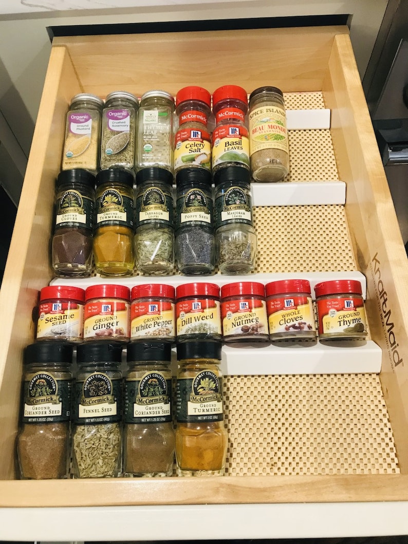 Kitchen organization products are what help make a kitchen more efficient. If you can't find what you need quickly, everything takes longer! Get a more efficient kitchen with these organization products you'll find on Etsy. This drawer organizer will change your life! 