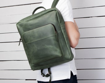 Minimalist green leather backpack with zipper