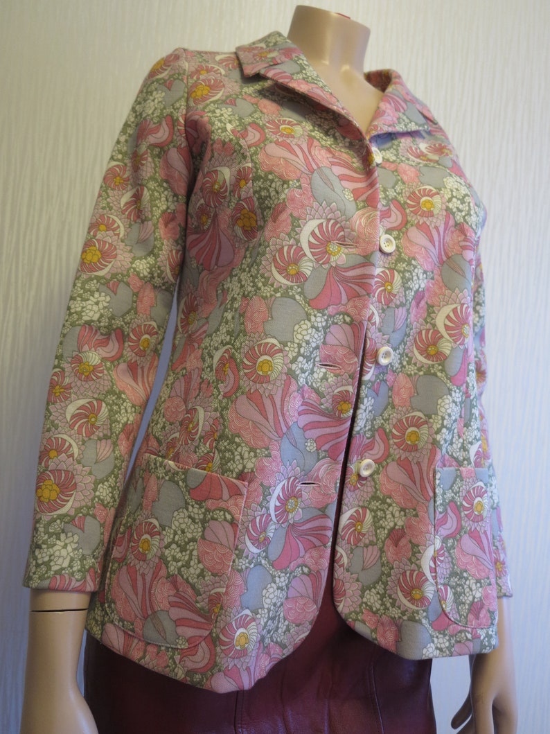 Colorful 70s vintage woman\u2019s jacket with floral print hippie style