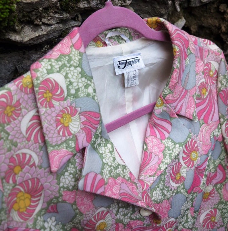 Colorful 70s vintage woman\u2019s jacket with floral print hippie style