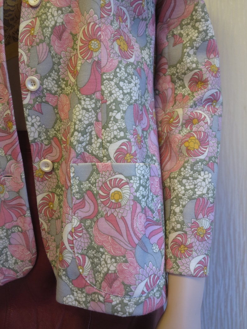 Colorful 70s vintage woman\u2019s jacket with floral print hippie style