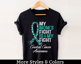 Może przedstawiać: Czarny T-shirt z turkusową wstążką wykonaną z serc i tekstem "My Mom's Fight Is My Fight" oraz "Cervical Cancer Awareness".