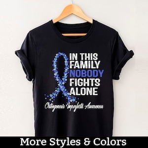 Osteogenesis Imperfecta Awareness Shirt, In This Family Nobody Fights Alone, Osteogenesis Imperfecta Support Squad, Warrior Fighter Shirts