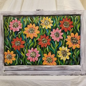 Handpainted vintage window art with brightly colored flowers and greenery.