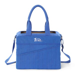 May include: A blue tote bag with a top handle and a detachable shoulder strap. The bag has a rectangular shape with a front pocket and the text "1st Place Products" in white. The bag is made of a durable fabric.