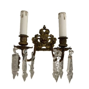 Antique small wall lamp for 2 lights. The face of an angel. Imitation candles.
