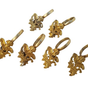 Vintage set of 6 bronze rings for hanging heavy curtains. Figurine of an angel.