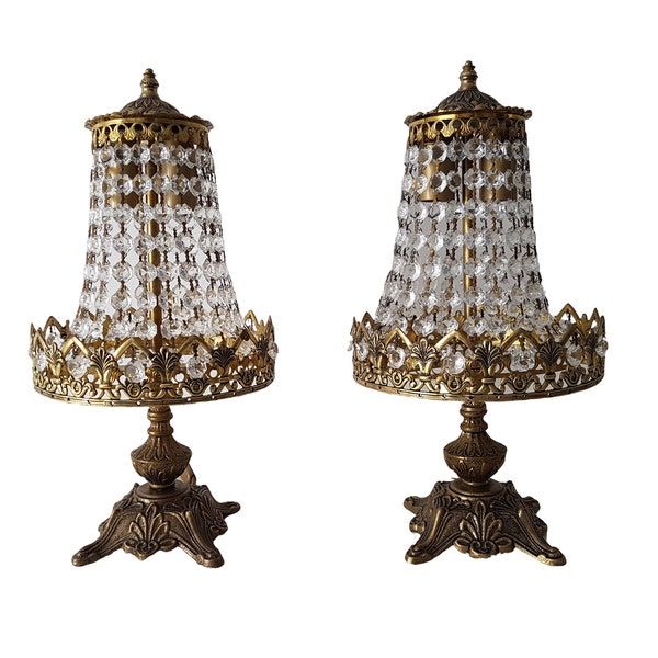 A pair of antique table lamps. Crystal chains made of clear glass. New electrical part. 2 light bulbs.