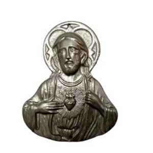 May include: A silver-colored religious icon depicting a figure with a halo, beard, and a heart with flames. The figure is wearing a robe and has a serene expression. The icon is likely made of metal and has a detailed, three-dimensional design.