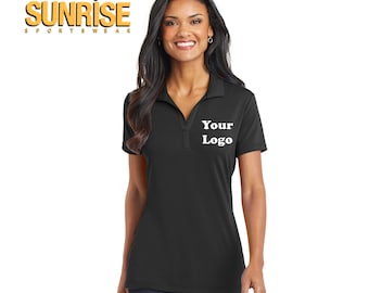 May include: A black women's polo shirt with short sleeves and a v-neck collar. The shirt has the text "Your Logo" embroidered on the left chest.