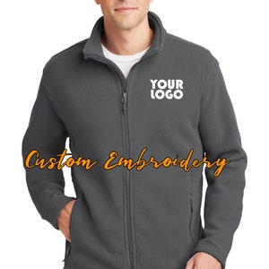 May include: A gray fleece jacket with a zipper closure and a white embroidered logo that says "YOUR LOGO".
