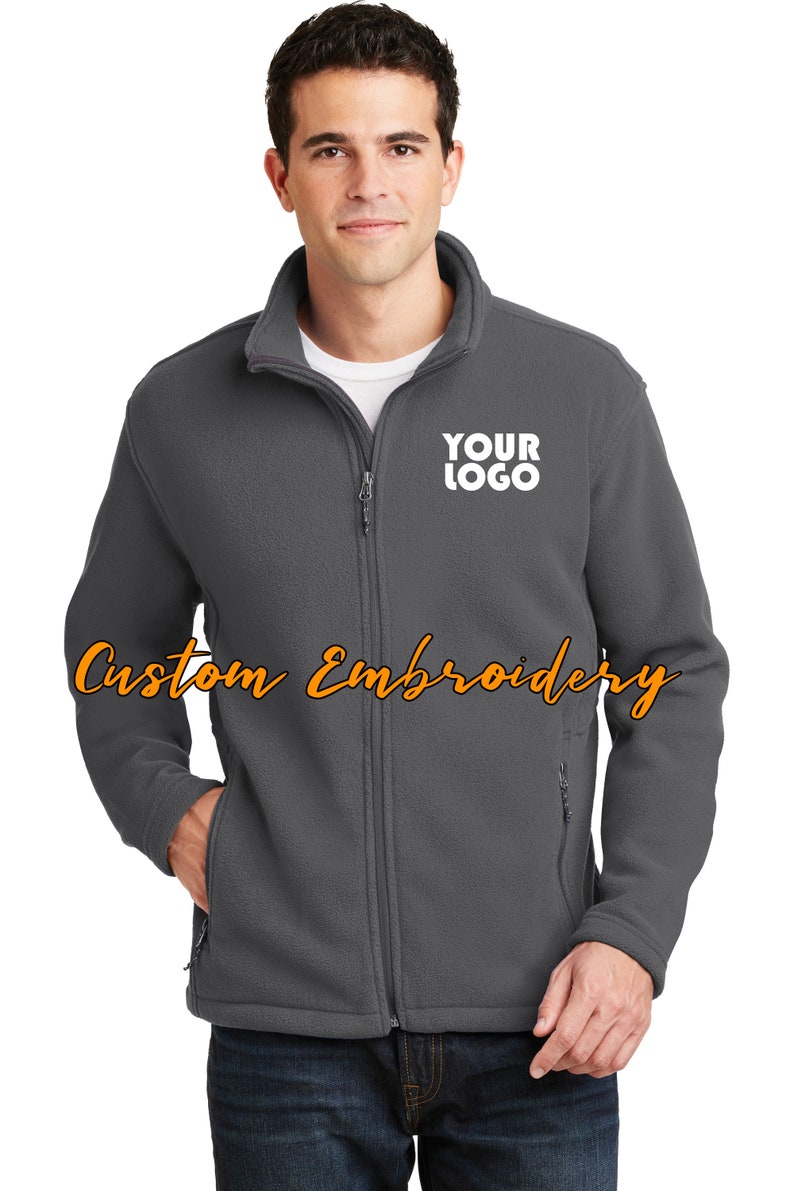 May include: A gray fleece jacket with a zipper closure and a white embroidered logo that says "YOUR LOGO".