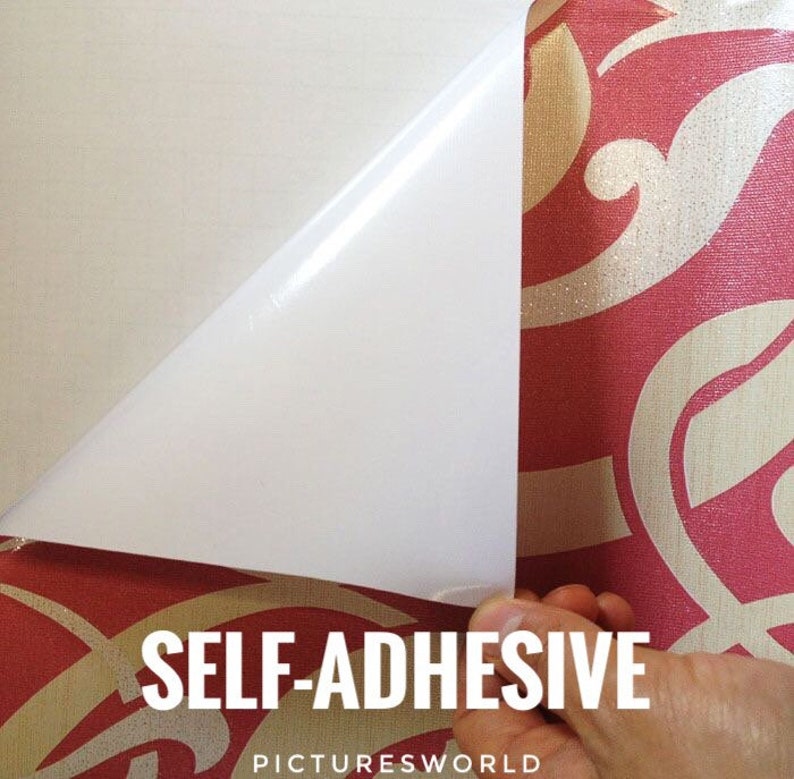 May include: A close-up of a white self-adhesive wallpaper roll with a red and gold patterned design. The adhesive backing is visible as a corner of the roll is peeled back. The text "SELF-ADHESIVE" and "PICTURESWORLD" is visible on the roll.