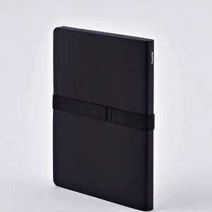 May include: A black notebook with a black elastic band closure. The notebook has a minimalist design and a smooth, matte finish. The word "nuuna" is printed vertically on the spine.