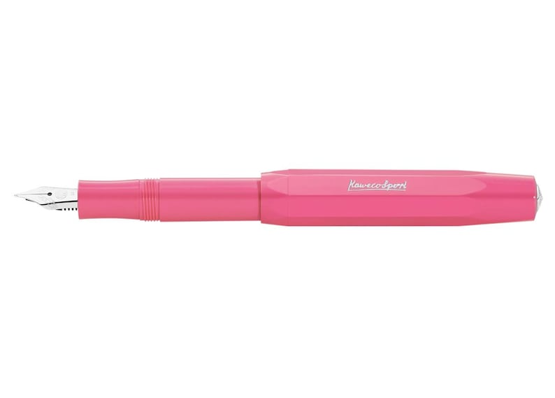 May include: A bright pink fountain pen with a silver nib. The pen has a sleek, modern design with the brand name "Kaweco Sport" printed on the barrel. The pen is a vibrant color and is set against a white background.