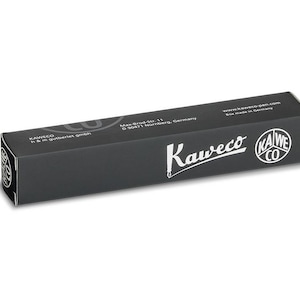 May include: A black rectangular box with the Kaweco logo and text. The box is made in Germany and has the address Max-Brau-Str. 11, D 90471 N&uuml;rnberg, Germany. The box is on a white background.