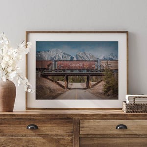 a picture of a train going over a bridge