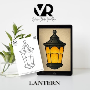 May include: A digital illustration of a black and yellow lantern displayed on a tablet. A black and white line drawing of the same lantern is on a white sheet of paper. The word "LANTERN" is at the bottom of the image.