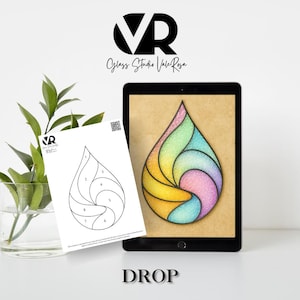 May include: A digital tablet displays a colorful, abstract teardrop design with rainbow hues. A printed template with numbered sections sits in front. The word "DROP" is at the bottom. The logo "VR Glass Studio Vale Rosa" is at the top.