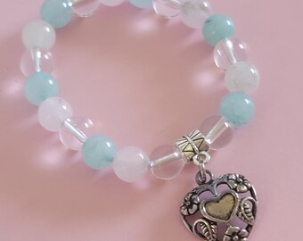 Heart charm(upcycled) stretch bracelet, child-size. Clear, sea mist green and pink glass beads.