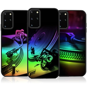 May include: Three phone cases with a colorful, abstract design of a turntable and record. The cases are black with a glossy finish.