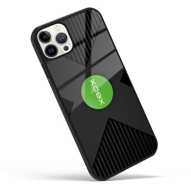 May include: Black phone case with a green Xbox logo and a black and white striped pattern.