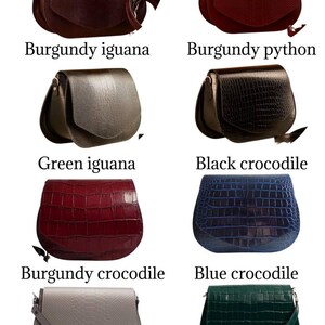 May include: Collection of eight leather crossbody bags in various colors and textures. Styles include burgundy iguana, burgundy python, green iguana, black crocodile, burgundy crocodile, blue crocodile, beige python, and green crocodile.