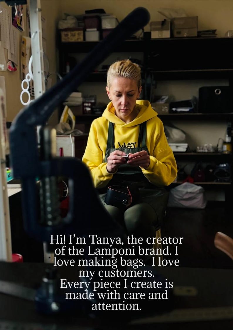 May include: A woman in a yellow hoodie and apron working on a leather bag. The image includes text that reads, "Hi! I'm Tanya, the creator of the Lamponi brand. I love making bags. I love my customers. Every piece I create is made with care and attention."