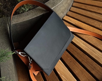 Bolso bandolera de piel negra y marrón, bolso rectangular estructurado, bolso de hombro pequeño o mediano, bolso de piel bicolor.