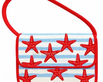 May include: A small, rectangular handbag with a red handle and trim. The bag features a white and blue striped pattern, adorned with vibrant red starfish. The design is reminiscent of a nautical theme, perfect for a beach outing.