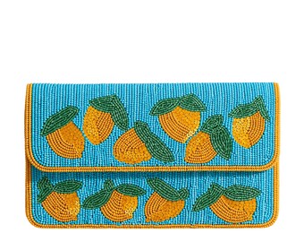 May include: A beaded clutch with a turquoise background and a pattern of orange and green fruit. The fruit is detailed with yellow beads and green leaves. The clutch has a fold-over flap and a gold trim.