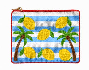 May include: A rectangular beaded pouch with a red border and gold zipper. The pouch features a blue and white striped background with yellow lemons and green palm trees.