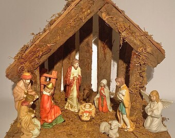 木製のキリスト降誕の像と素焼きの人形が付いたヴィンテージのキリスト