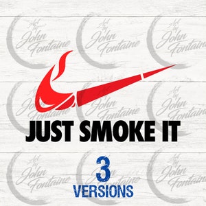May include: A red and black graphic design with a swoosh and a flame. The text "JUST SMOKE IT" is below the graphic. The image has a wood grain background and the text "Art by John Fontaine" appears in a circle in the corners of the image. The text "3 VERSIONS" appears below the graphic.