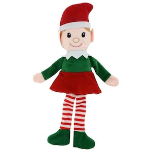 May include: A soft toy elf doll wearing a red hat, green top, and red skirt. The elf has white trim on the hat and collar, with red and white striped legs and green shoes. The doll has a smiling face with rosy cheeks.