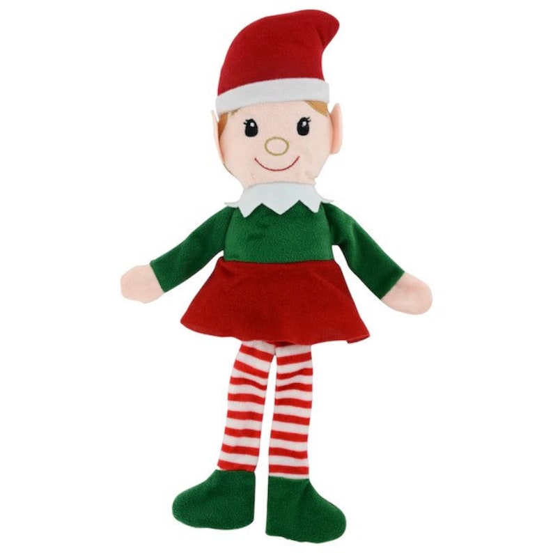 May include: A soft toy elf doll wearing a red hat, green top, and red skirt. The elf has white trim on the hat and collar, with red and white striped legs and green shoes. The doll has a smiling face with rosy cheeks.