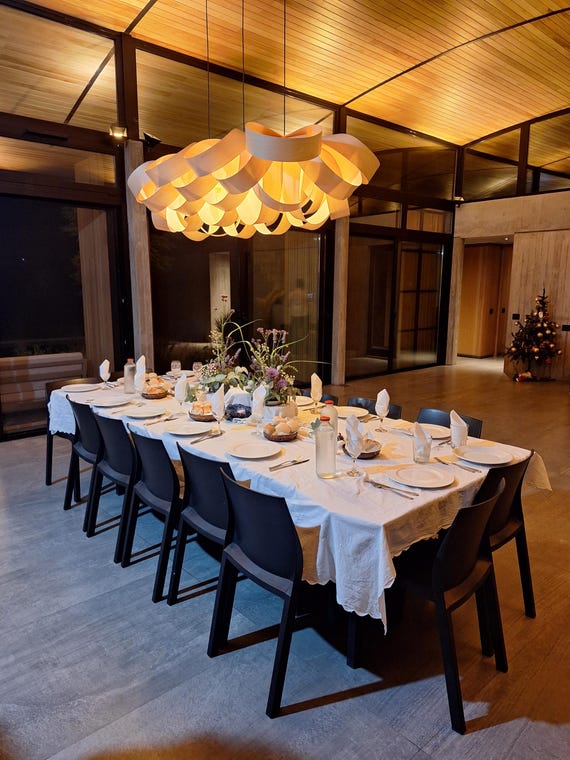 A genuinely sculptural, large-format wooden linear chandelier that looks like it belongs in an architectural magazine — the kind of statement piece you can't find at IKEA.
