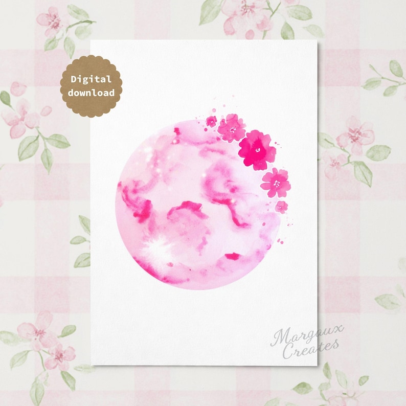 May include: A digital download art print featuring a circular watercolour painting in shades of pink. The circle contains abstract pink washes and is decorated with a cluster of small, vibrant pink flowers on the upper right edge. Text reads Digital download.