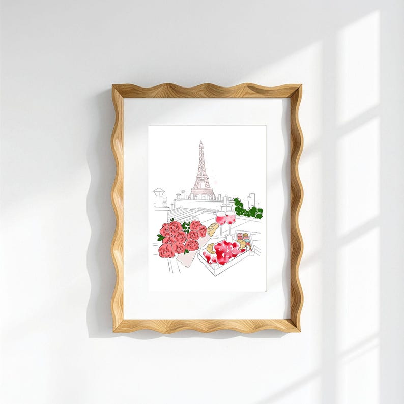 Puede incluir: Una l&aacute;mina enmarcada con un dibujo lineal de la Torre Eiffel de Par&iacute;s, acompa&ntilde;ado de una ilustraci&oacute;n en acuarela de un ramo de rosas rosas, dos copas de vino y una bandeja de pasteles variados sobre una azotea.