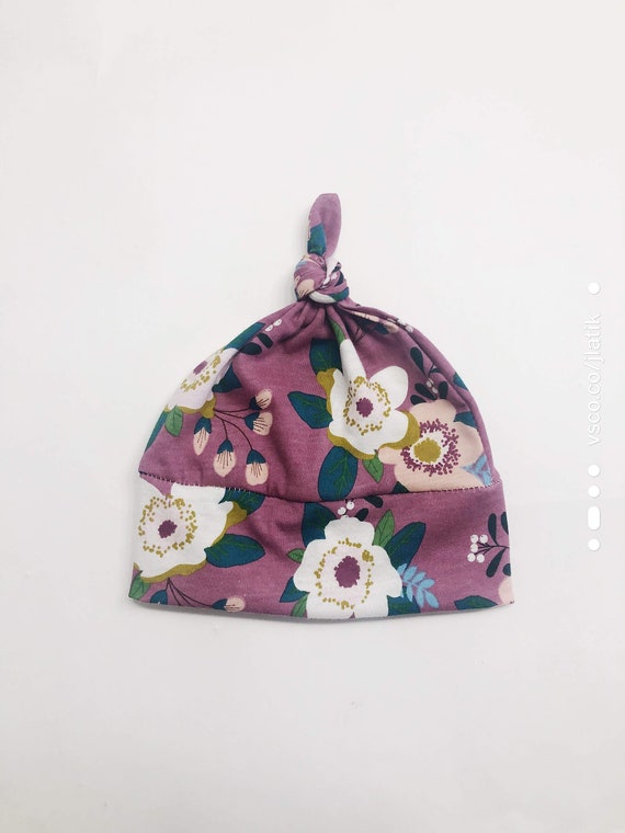 purple beanie baby with white flower
