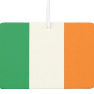 May include: A car air freshener with the Irish flag colors: green, white, and orange.