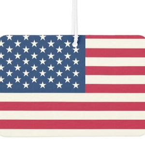 May include: A car air freshener featuring a vintage-style American flag design with red and white stripes and blue stars.