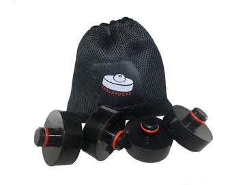 May include: Set of four black car jack pads with red rubber rings, in a black mesh bag with the logo "TESLAPUCKS" printed on it.