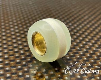 Ghost Jade and Ivory G10 with Brass lanyard bead for paracord.  Handmade in the USA.