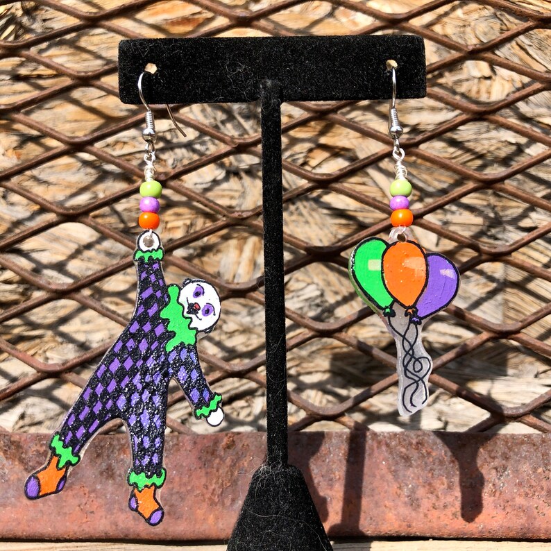 CLOWNIN\u2019 AROUND TOWN hand painted mismatched clown earrings
